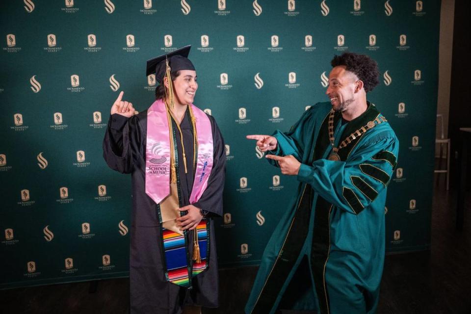 Graduating Sacramento State student Sofia del Pilar Roca Castro poses for a photo with President Luke Wood before the commencement ceremony at Golden 1 Center on Friday, May 17, 2024. Roca Castro received the President’s Medal and was one of seven Dean’s Award recipients.