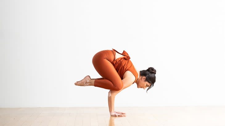 Woman in Crow Pose