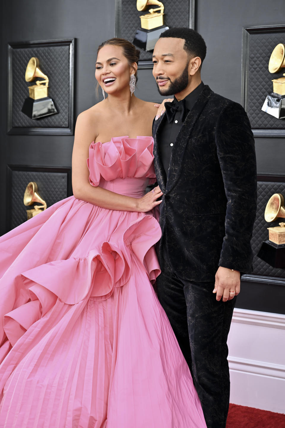 Chrissy Teigen and John Legend at the 64th Annual Grammy Awards held at the MGM Grand Garden Arena on April 3rd, 2022 in Las Vegas, Nevada.