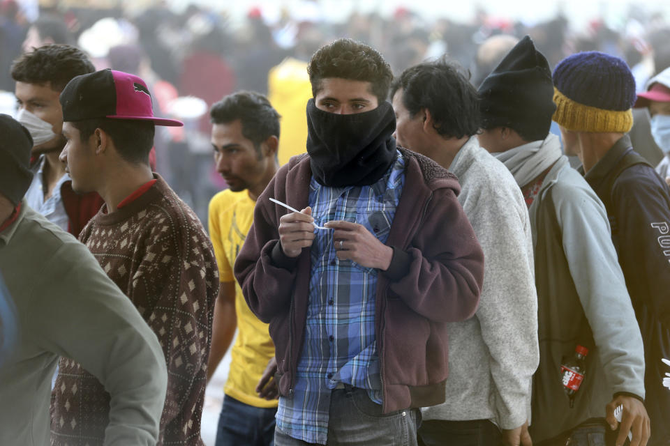 Central American immigrants line up for breakfast at a shelter in Piedras Negras, Mexico, Tuesday, Feb. 5, 2019. A caravan of about 1,600 Central American migrants camped Tuesday in the Mexican border city of Piedras Negras, just west of Eagle Pass, Texas. The governor of the northern state of Coahuila described the migrants as "asylum seekers," suggesting all had express intentions of surrendering to U.S. authorities. (Jerry Lara/The San Antonio Express-News via AP)