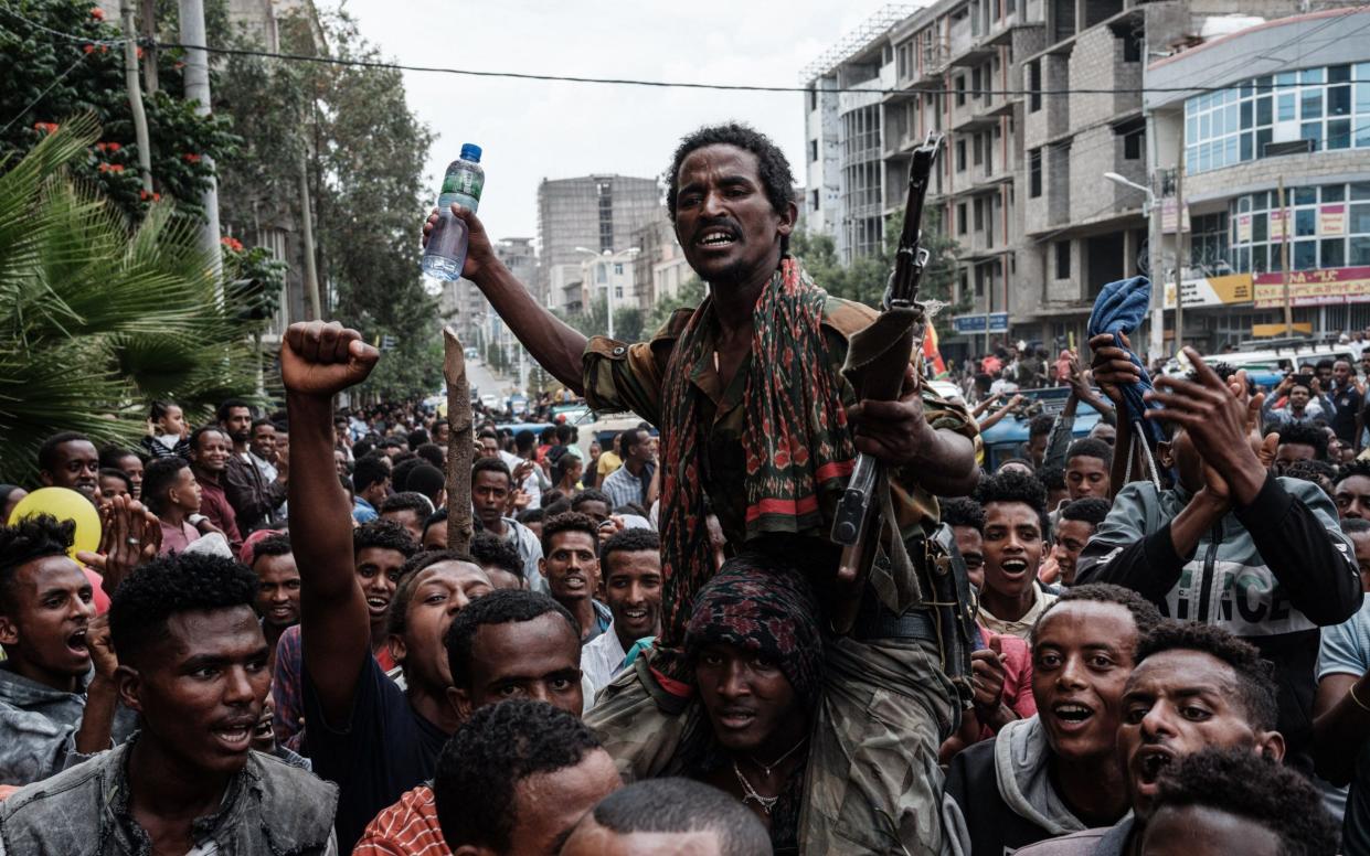  A soldier of Tigray Defence Force (TDF) is escorted by people on a street as he returns in Mekele, the capital of Tigray region, Ethiopia - afp/afp