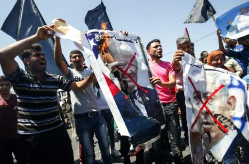 Palestinians demonstrate in the Gaza Strip against the US-sponsored Middle East economic conference