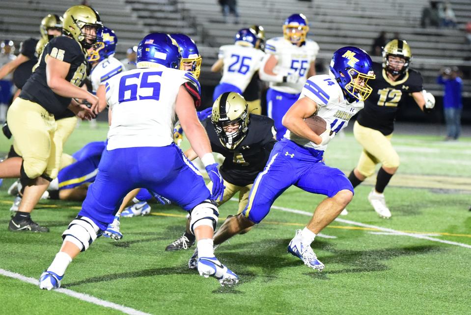 Maine-Endwell's Vinny Mancini carries the ball in a 43-42 win over Corning in football Sept. 22, 2023 at Corning Memorial Stadium.