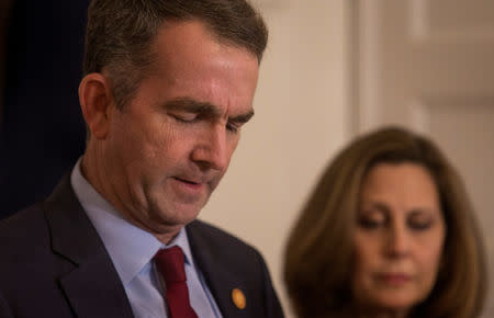 Virginia Governor Ralph Northam, accompanied by his wife Pamela Northam announces he will not resign during a news conference in Richmond, Virginia, U.S. February 2, 2019. Picture taken February 2, 2019. REUTERS/ Jay Paul