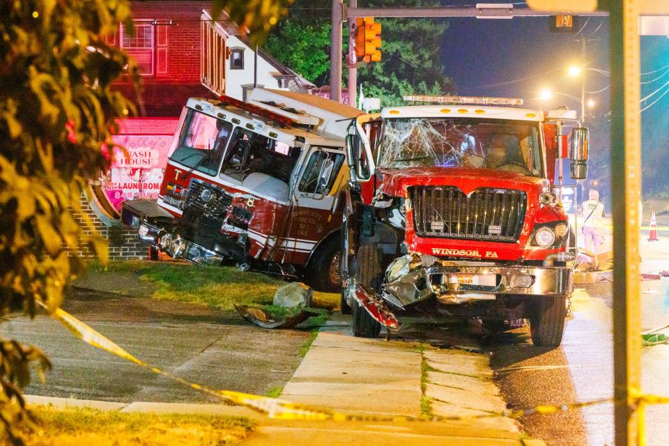A York New Salem tanker 8, left, and a Laurel Fire Department tanker 37, right, were involved in a crash in the intersection of Mount Rose Avenue and Hill Street while battling a massive warehouse fire in York City.