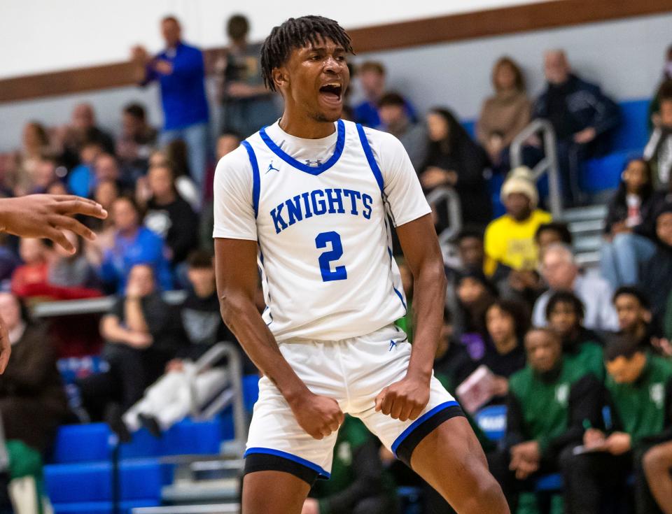 Marian's Dareon Thornton (2) celebrates during the Washington vs. Marian boys basketball game Friday, Jan. 27, 2023 at Marian High School.