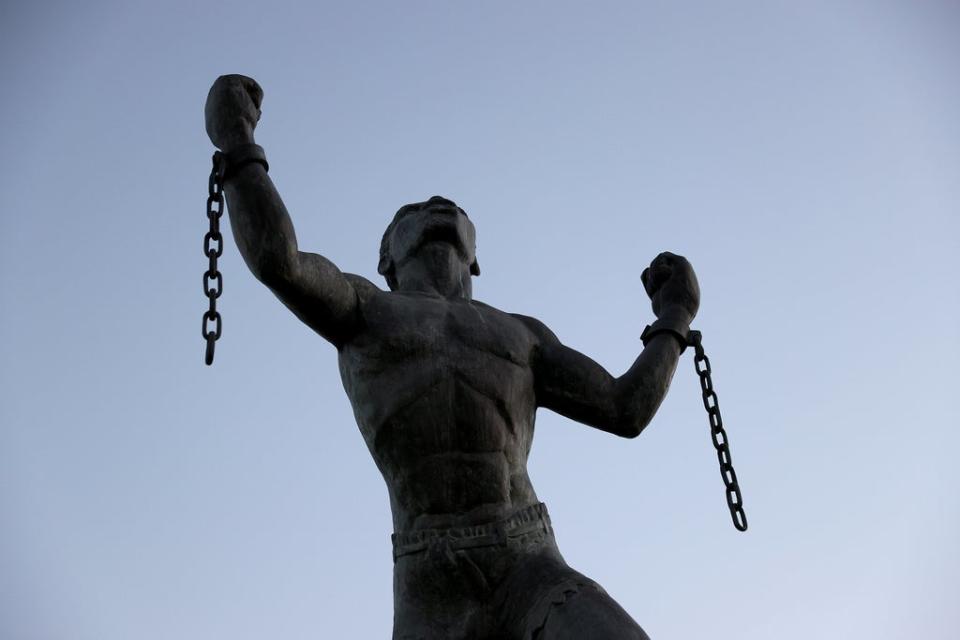 The ‘Bussa Emancipation Statue’ in Bridgetown symbolises the breaking of the chains of slavery at the moment of emancipation (Getty)