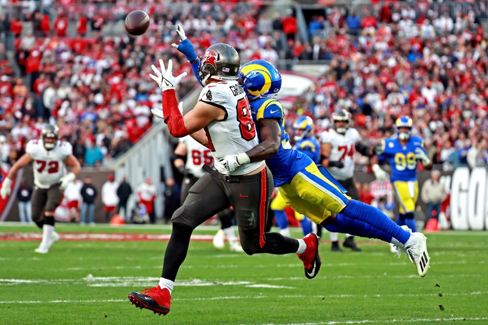 Jan 23, 2022; Tampa, Florida, USA; Los Angeles Rams safety Nick Scott (33) breaks up a pass to Tampa Bay Buccaneers tight end Rob Gronkowski (87) during the second half in a NFC Divisional playoff football game at Raymond James Stadium. Mandatory Credit: Matt Pendleton-USA TODAY Sports