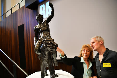 Art lovers take a close-up look at 'Rothschild Bronzes', confirmed as the only surviving bronze sculpture by Michelangelo, during an event at The Royal Academy of Arts (RA) in London, Britain, November 14, 2018. REUTERS/Dylan Martinez