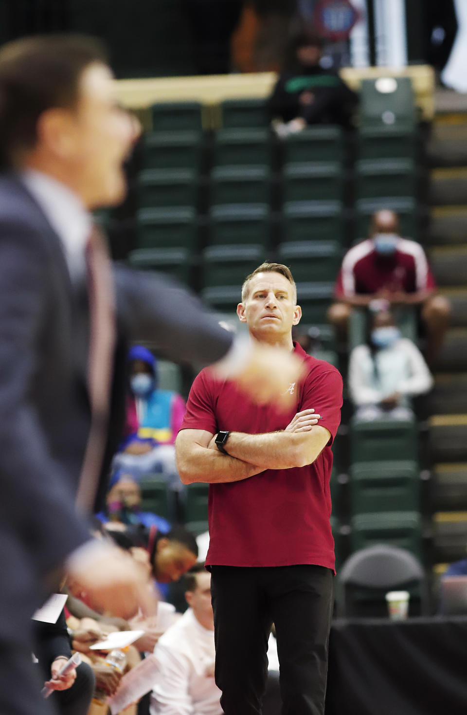 Alabama head coach Nick Oats looks on during the first half of an NCAA college basketball game against Iona, Thursday, Nov. 25, 2021, in Orlando, Fla. (AP Photo/Jacob M. Langston)