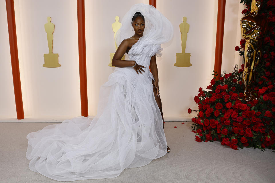 <p>Tems poses on the champagne-colored red carpet during the Oscars arrivals at the 95th Academy Awards in Hollywood, Los Angeles, California, U.S., March 12, 2023. REUTERS/Eric Gaillard</p> 