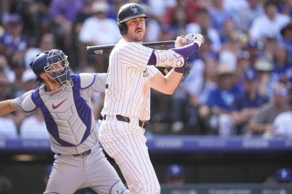 Colorado Rockies' Nolan Jones reacts after striking out against Los Angeles Dodgers relief pitcher Edgardo Henriquez in the ninth inning of a baseball game, Sunday, Sept. 29, 2024, in Denver. (AP Photo/David Zalubowski)