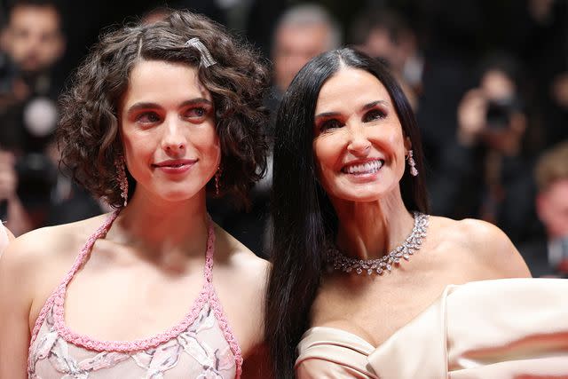 <p>Pascal Le Segretain/Getty Images</p> Margaret Qualley and Demi Moore at the Cannes Film Festival on May 19, 2024