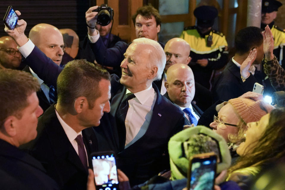 President Joe Biden takes a selfie with people in the crowd as he leaves after speaking at the Windsor Bar and Restaurant in Dundalk, Ireland, Wednesday, April 12, 2023. (AP Photo/Patrick Semansky)