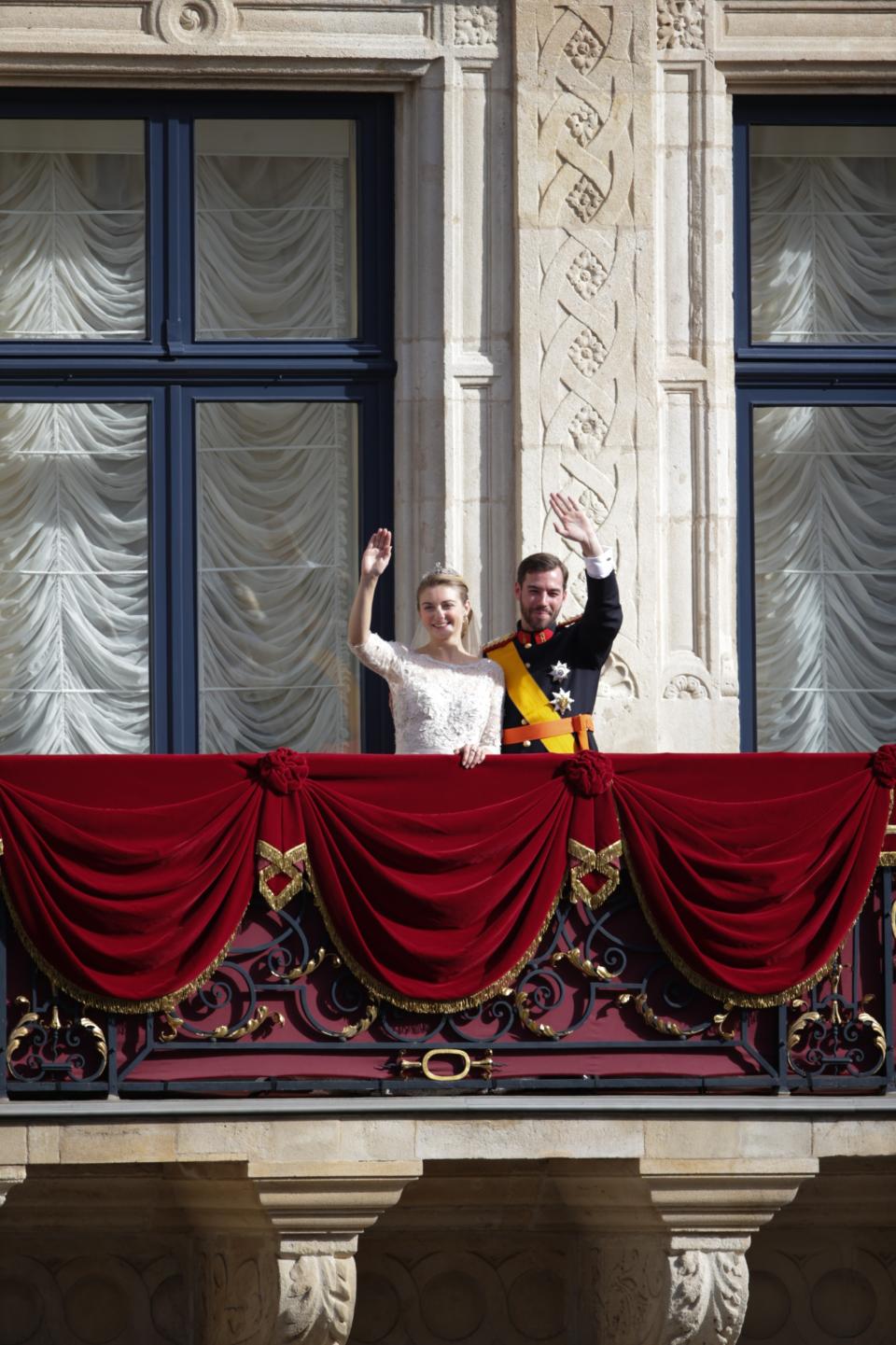 LUXEMBOURG - OCTOBER 20: (NO SALES, NO ARCHIVE) In this handout image provided by the Grand-Ducal Court of Luxembourg, Princess Stephanie of Luxembourg and Prince Guillaume of Luxembourg wave from the balcony of the Grand-Ducal Palace after their wedding ceremony at the Cathedral of our Lady of Luxembourg on October 20, 2012 in Luxembourg, Luxembourg. The 30-year-old hereditary Grand Duke of Luxembourg is the last hereditary Prince in Europe to get married, marrying his 28-year old Belgian Countess bride in a lavish 2-day ceremony. (Photo by Grand-Ducal Court of Luxembourg via Getty Images)