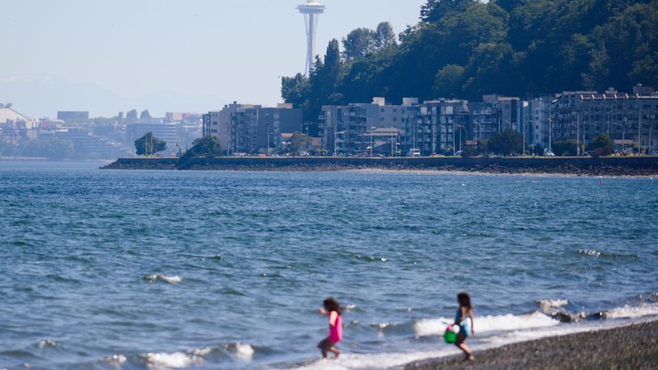 <div>Children play in the water at Alki Beach during a heatwave in Seattle, Wash., on Sunday, June 27, 2021.</div> <strong>(Chona Kasinger/Bloomberg via Getty Images)</strong>
