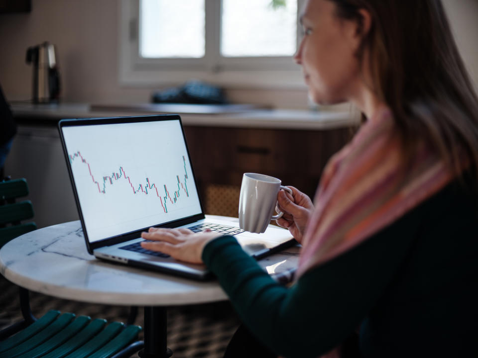 Entrepreneur Woman Checking Her Stock Market Investment Using Laptop Computer