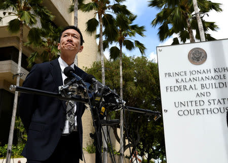 Hawaii Attorney General Douglas Chin answers questions from the media at the U.S. District Court Ninth Circuit after presenting his arguments after filing an amended lawsuit against President Donald Trump's new travel ban in Honolulu, Hawaii, March 15, 2017. REUTERS/Hugh Gentry
