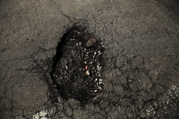 Harsh Winter Creates High Number Of Potholes On New York City's Roads