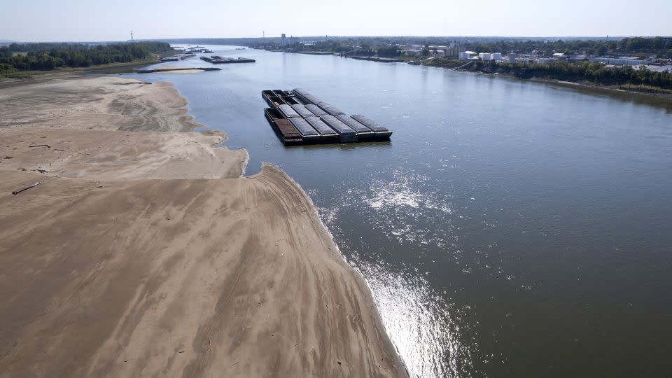 Barges float in the Mississippi River as a portion of the riverbed is exposed on September 15 in St. Louis.  - Jeff Roberson/AP