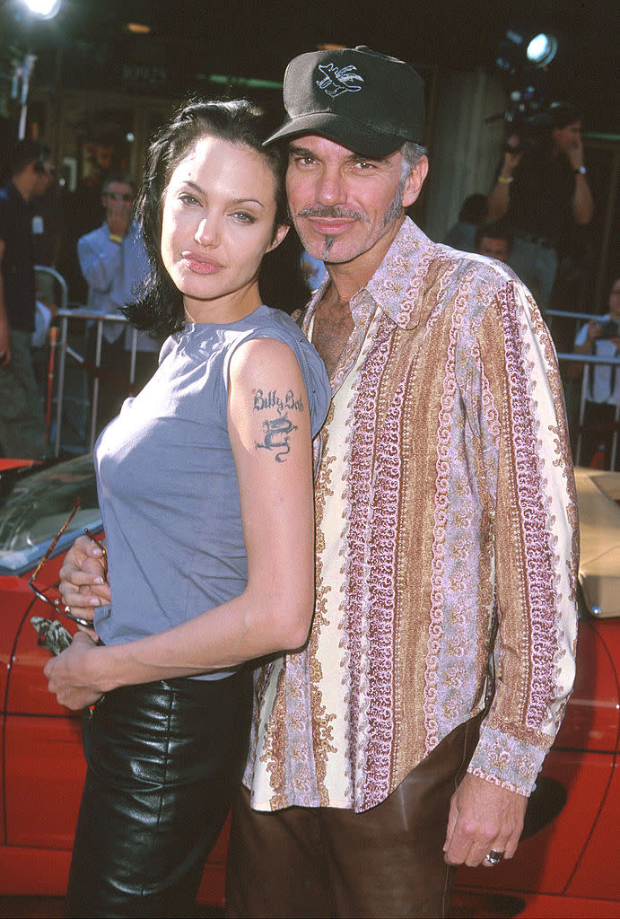 closeup of the two in leather pants and angelina's billy bob tattoo