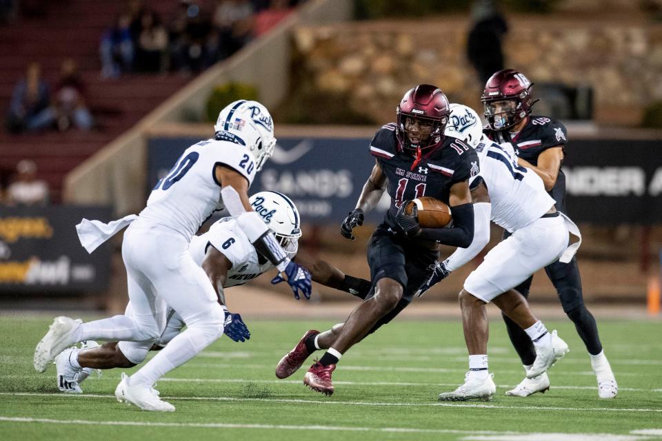 NMSU wide receiver Cordell David runs the ball during the New Mexico State University game on Saturday, Aug. 27, 2022, at the Aggie Memorial Stadium. 