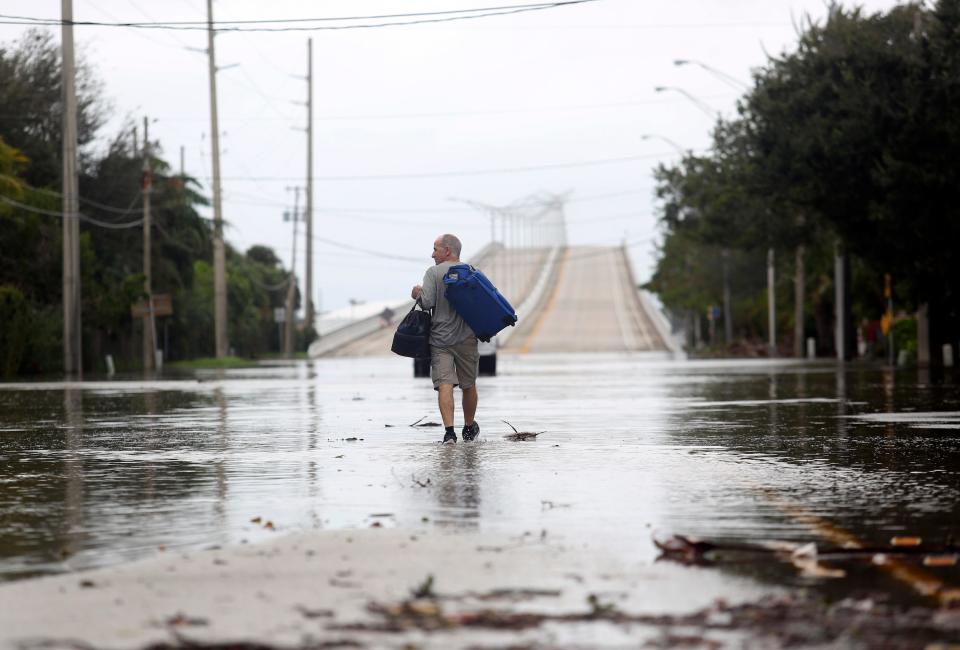 The east side of the Alma Lee Loy Bridge experienced flooding Thursday, Nov. 10, 2022, after Hurricane Nicole made landfall in Vero Beach. Law enforcement blocked both sides of the bridge from regular traffic, allowing residents to drive through. 