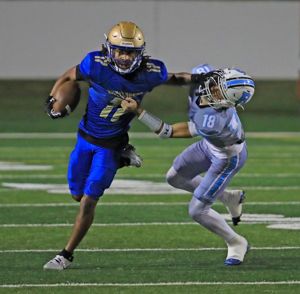 Mainland’s Elyjah Gilyard (17) stiff-arms a Rockledge defender on a return during Friday's Region 3-3S semifinal at Daytona Stadium, Nov. 17, 2023.