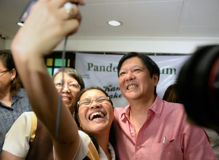 Teachers take a "selfie" with Philippine Senator Ferdinand "Bongbong" Marcos Jnr. in Manila on October 7, 2015