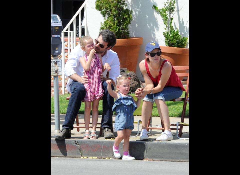 It was a family affair at the Fourth of July parade in the Pacific Palisades area of Los Angeles. Ben Affleck and wife Jennifer Garner took their adorable little ladies, Violet, 5, and her younger sister Seraphina, 2, to show their red, white and blue pride on July 4th.