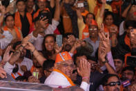 Gujarat Chief Minister Bhupendra Patel greets Bharatiya Janata party (BJP) supporters as they celebrate lead for the party in Gujarat state elections in Gandhinagar, India, Thursday, Dec. 8, 2022. Indian Prime Minister Narendra Modi’s Hindu nationalist party is all set to keep its 27-year-old control of his home Gujarat state in a record state legislature win. (AP Photo/Ajit Solanki)