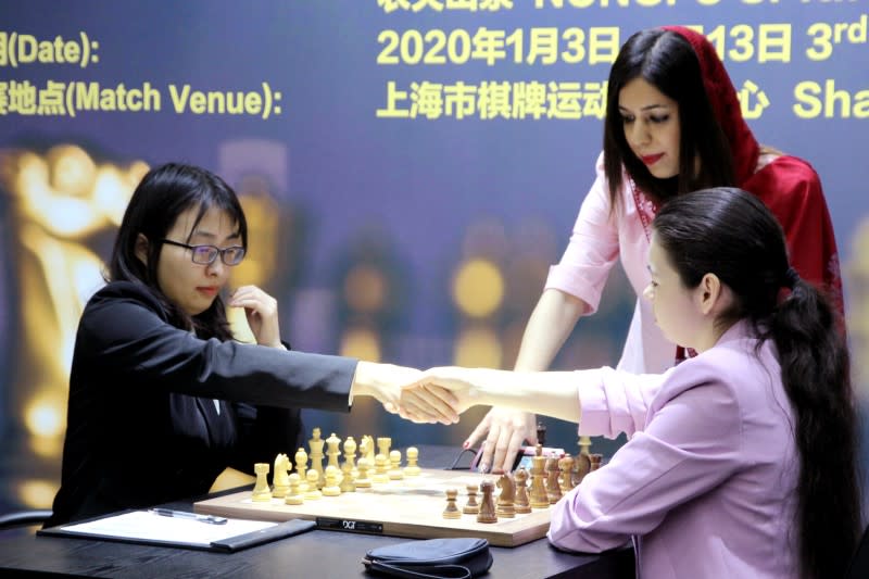 Iran chess referee Shohreh Bayat wearing hijab looks on during the Women's World Chess Championship in Shanghai