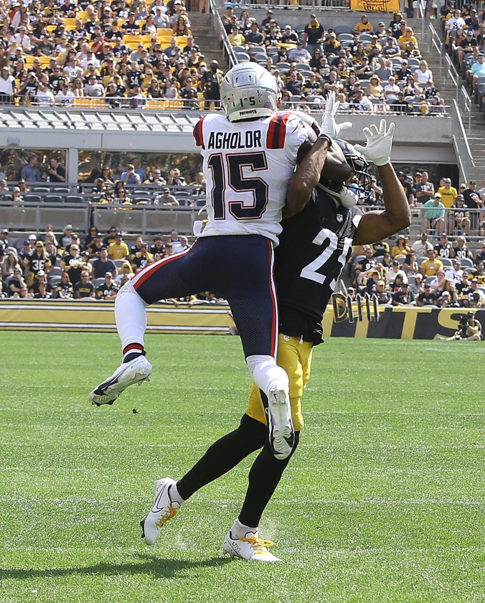 Patriots wide receiver Nelson Agholor goes over Steelers cornerback Ahkello Witherspoon to catch a touchdown pass during the second quarter of Sunday's game.