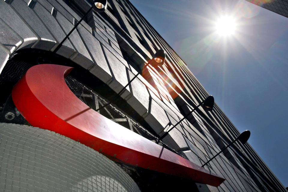 Sun shines down on a large Nike Swoosh at the Niketown store in downtown Portland, Ore., Tuesday, June 26, 2007. Nike Inc. is expected to release fiscal fourth-quarter financial results after markets close today.(AP Photo/Don Ryan)