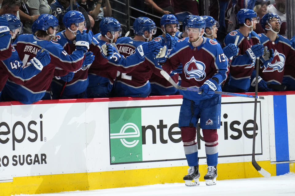 Colorado Avalanche right wing Valeri Nichushkin (13) is congratulated for a goal against the St. Louis Blues during the second period in Game 1 of an NHL hockey Stanley Cup second-round playoff series Tuesday, May 17, 2022, in Denver. (AP Photo/Jack Dempsey)