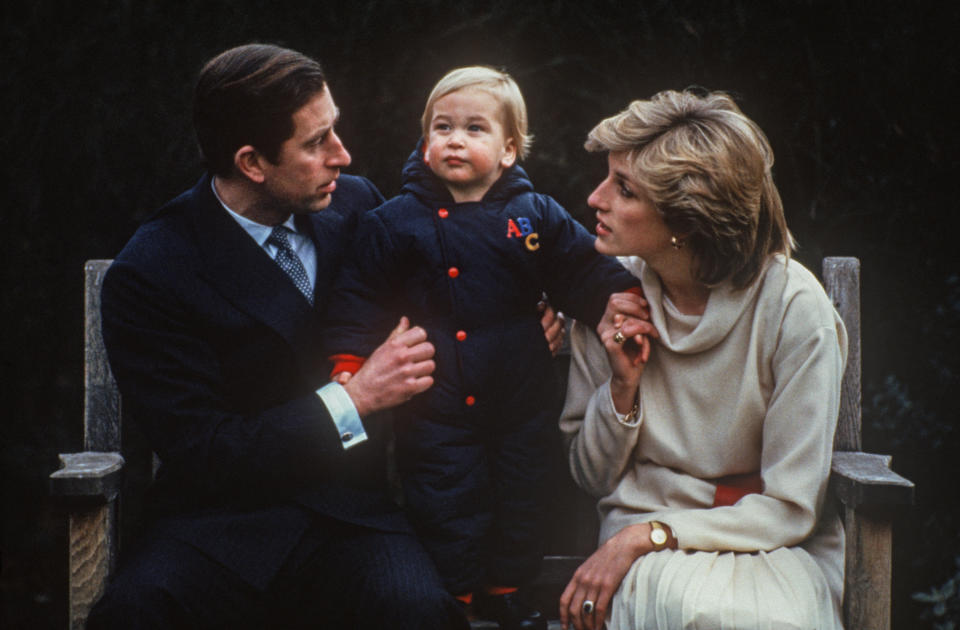 Prince Charles and Princess Diana sit with Prince William at a photocall in the garden of Kensington Palace on Dec. 14, 1983.