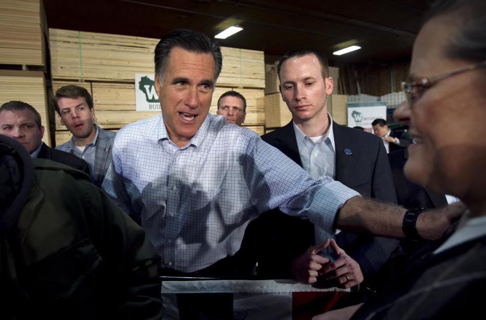 Republican presidential candidate, former Massachusetts Gov. Mitt Romney greets the crowd during a campaign stop at a building supply store in Green Bay, Wis., Monday, April 2, 2012. (AP Photo/Steven Senne)