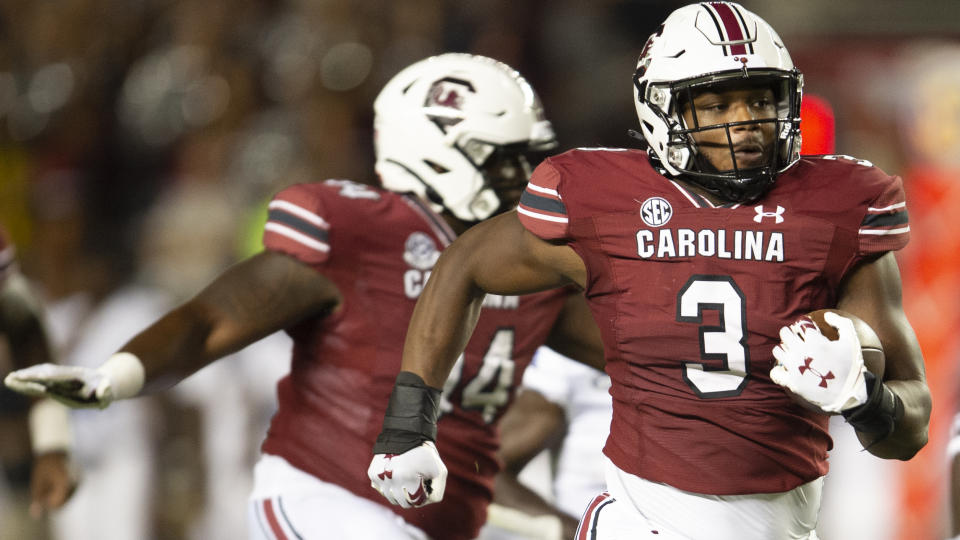 South Carolina defensive end Jordan Burch (3) returns a pick six during the second half of an NCAA college football game against against the Eastern Illinois, Saturday, Sept. 4, 2021, in Columbia, S.C. (AP Photo/Hakim Wright Sr)