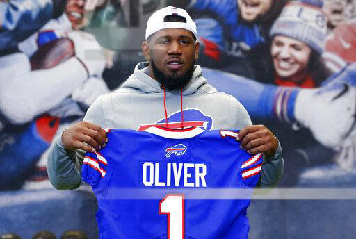 File-This April 27, 2019, file photo shows Buffalo Bills first round draft pick Ed Oliver posing for photographs following an NFL football news conference in Orchard Park N.Y. Oliver was arrested Saturday, May 16, 2020, by police in the Houston area and charged with drunk driving and illegally carrying a gun. Montgomery County sheriff’s deputies pulled Oliver over after receiving reports around 9 p.m. of someone driving recklessly in a construction area north of the city, local media outlets reported, citing jail and police records and statements from sheriff's officials. (AP Photo/Jeffrey T. Barnes, File)