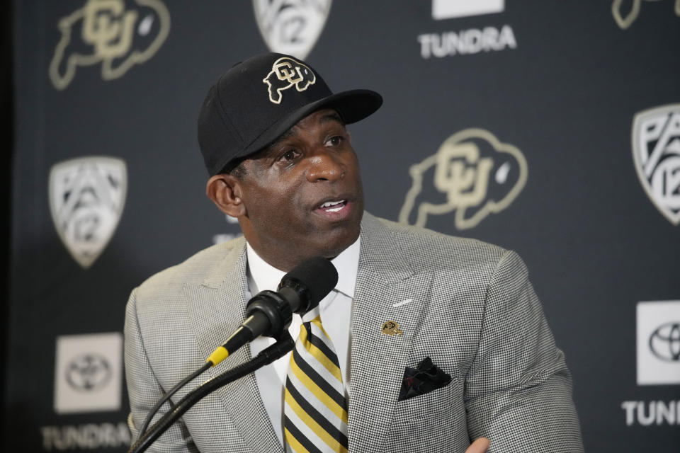 FILE - Deion Sanders speaks after being introduced as the new head football coach at the University of Colorado during a news conference Sunday, Dec. 4, 2022, in Boulder, Colo. The spring transfer window for college football players closed with 43 scholarship players -- the equivalent of half a roster -- from coach Deion Sanders' Colorado program having entered the portal since the spring game was played on April 15. (AP Photo/David Zalubowski, File)