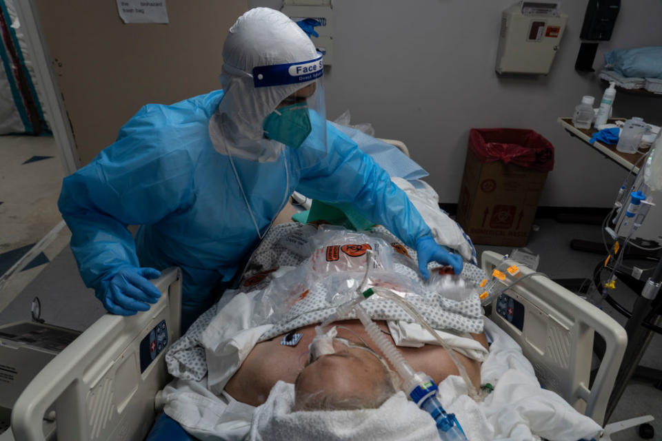 A medical staff member treats a patient suffering from the coronavirus disease (COVID-19) in the COVID-19 intensive care unit (ICU) at the United Memorial Medical Center in Houston, Texas. 