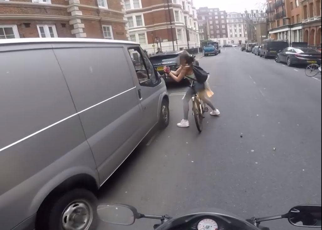 Cyclist's revenge?: The furious woman ripped a wing mirror off the van in the video that went viral