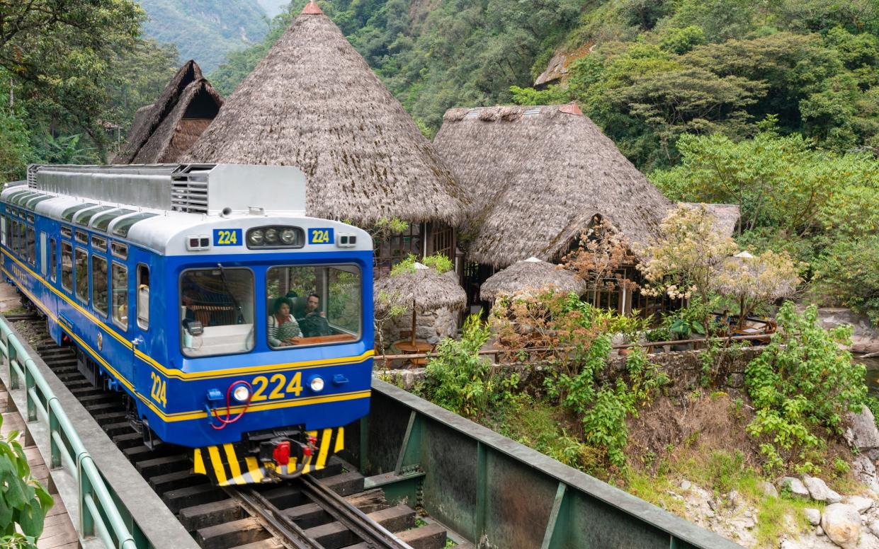 Peru Rail train arriving at Machu Picchu Station - Alamy