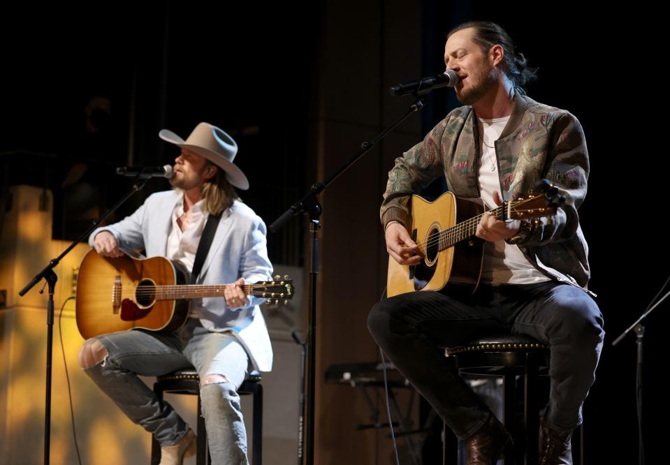 NASHVILLE, TENNESSEE - FEBRUARY 06: (L-R) Brian Kelley and Tyler Hubbard of Florida Georgia Line perform onstage for Florida Georgia Line: Mix It Up Strong Exhibit opening day at Country Music Hall of Fame and Museum on February 06, 2022 in Nashville, Tennessee. (Photo by John Shearer/Getty Images for Country Music Hall of Fame and Museum)