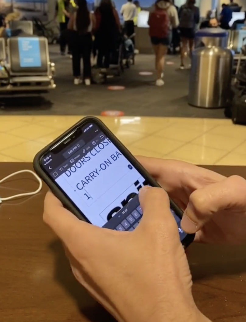 A still from a TikTok video showing an apparent 'hack' to get free carry-on baggage with Spirit Airlines.