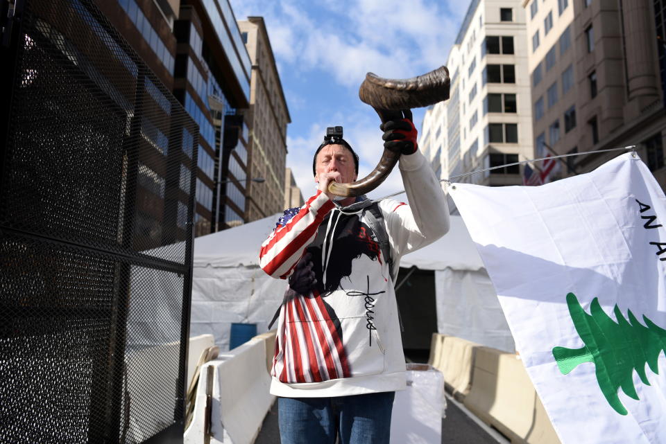 David Wood, of Reno, plays a shofar during a prayer walk ahead of U.S. President-elect Joe Biden's Presidential Inauguration in front of the White House, in Washington, U.S., January 19, 2021.  (Callaghan O'Hare/Reuters)