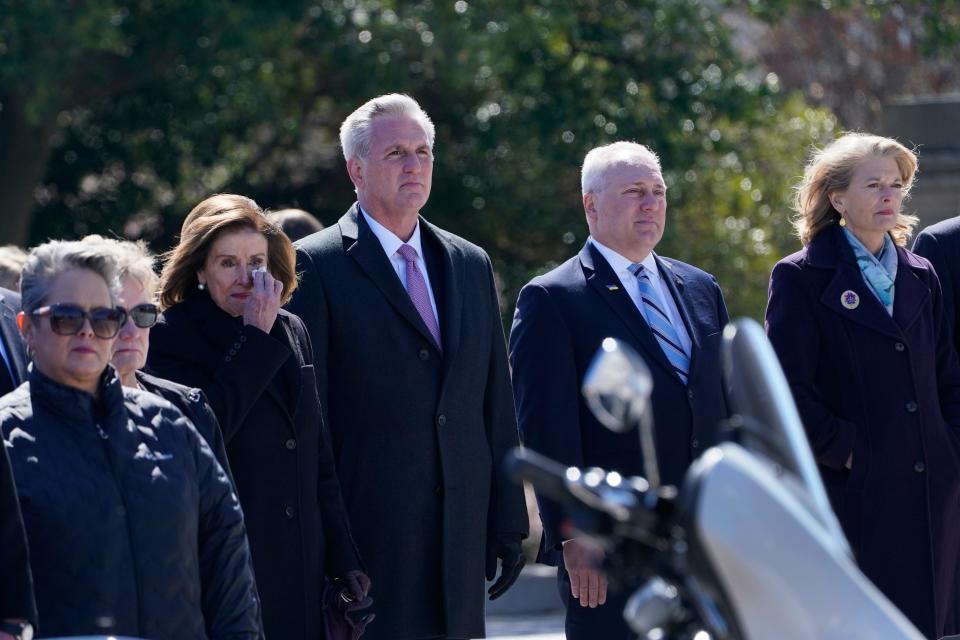 House Speaker Nancy Pelosi of Calif., House Minority Leader Kevin McCarthy of Calif., House Minority Whip Steve Scalise, R-La., and Sen. Lisa Murkowski, R-Alaska, watch as the casket of Rep. Don Young, R-Alaska, is carried down the steps of the House of Representatives on Capitol Hill in Washington, Tuesday, March 29, 2022.