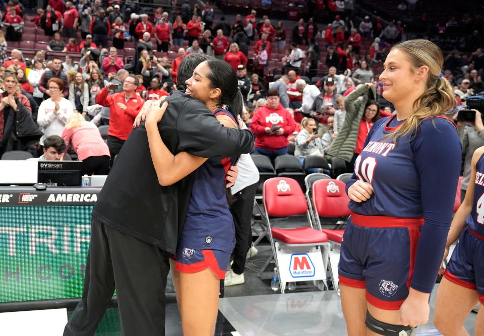 Belmont guard Kilyn McGuff gets a hug from her dad, Ohio State coach Kevin McGuff, after Friday's game.