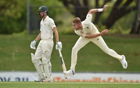 England's paceman Stuart Broad (R) bowls against Cricket Australia XI batsman Jake Carder - Credit: Getty Images