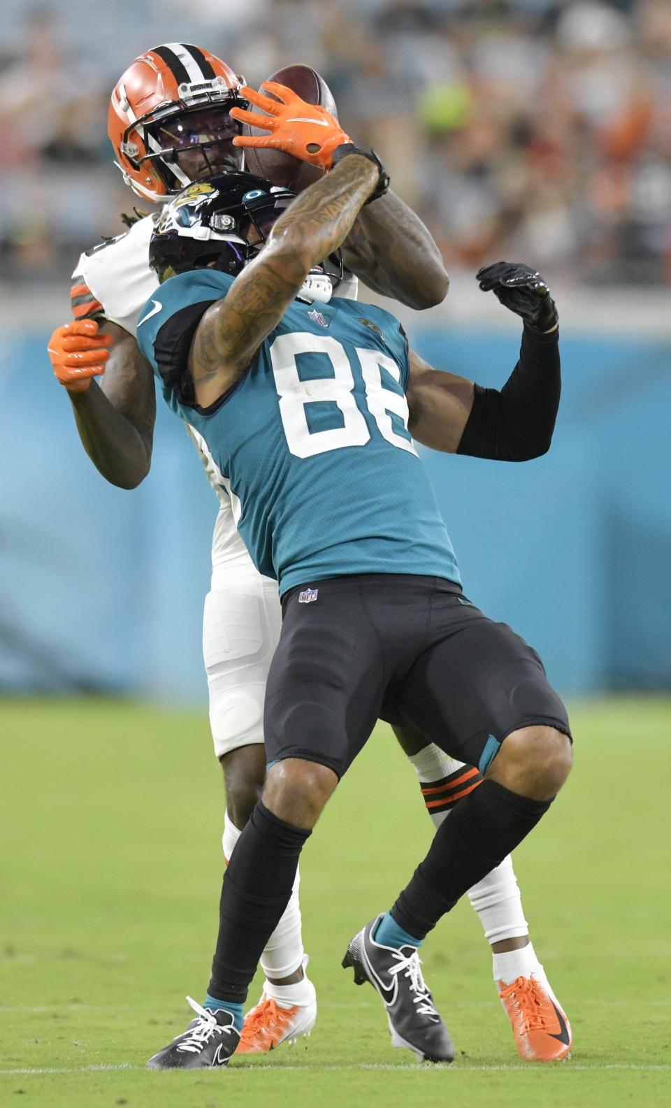 Cleveland Browns cornerback Martin Emerson Jr. (23) strips the ball from Jacksonville Jaguars wide receiver Jeff Cotton Jr. (88) on a late second quarter pass play from Jaguars quarterback C.J. Beathard (3) during late second quarter action. Emerson ran the ball back for a Browns' touchdown. The Jacksonville Jaguars hosted the Cleveland Browns at TIAA Bank Field in Jacksonville, Florida Friday, August 12, 2022 for the first home preseason game of the season. [Bob Self/Florida Times-Union]